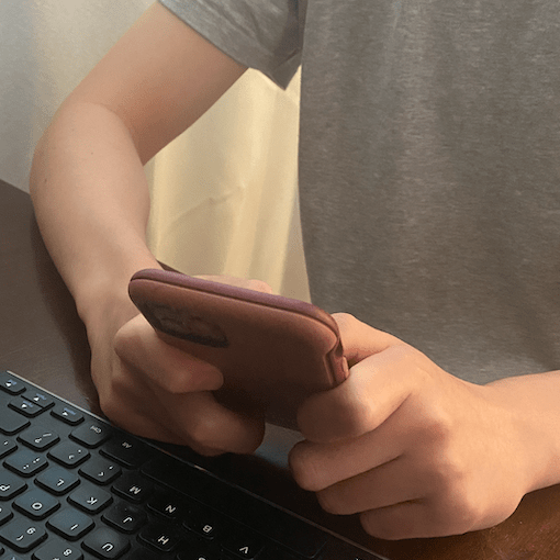 Young person's hands and phone