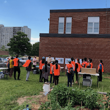 Group of community members gathered outside school