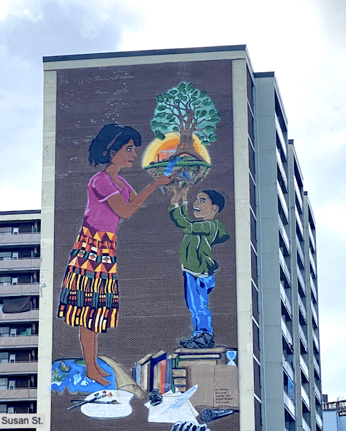 Mural of woman, child and tree on Woburn Susan apartment building in Cedarbrae